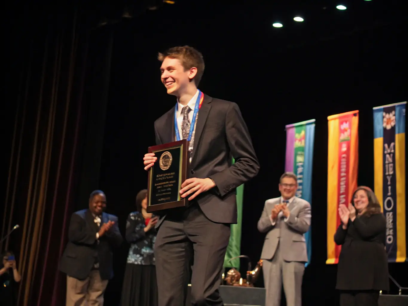 An image of a successful South African business leader receiving an award, representing the achievement and recognition that Challengebfemt aims to help its clients attain.